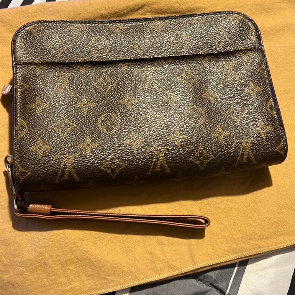 - This is the LV Orsay clutch! Beautiful condition just some peeling on th…